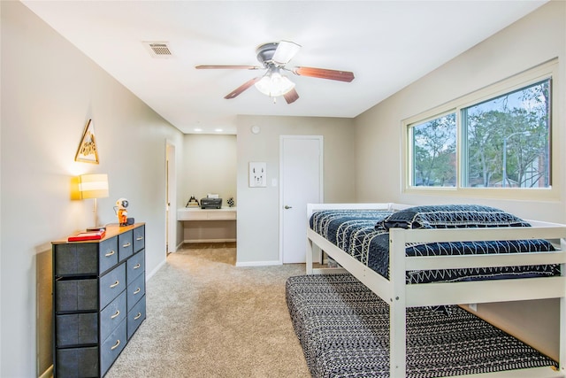 bedroom with light colored carpet and ceiling fan