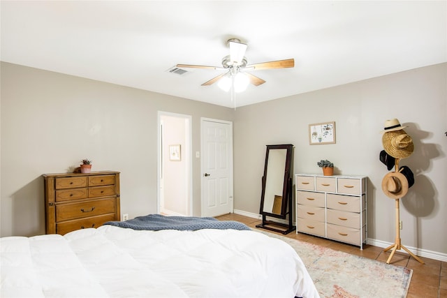 tiled bedroom with ceiling fan