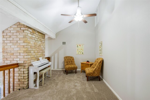 living area featuring light carpet, ceiling fan, and lofted ceiling