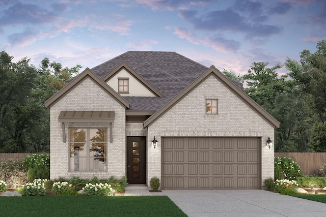 french country home featuring brick siding, roof with shingles, concrete driveway, and fence