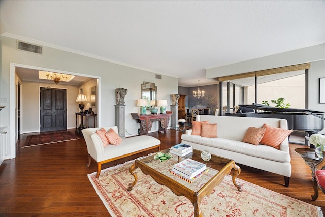 living room featuring ornamental molding, an inviting chandelier, a wealth of natural light, and dark wood-type flooring