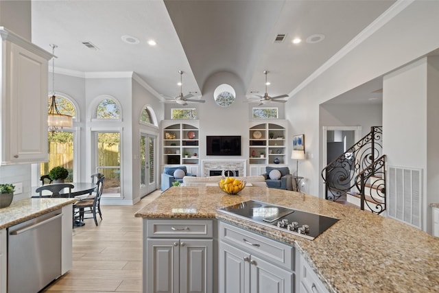 kitchen featuring white cabinetry, light wood-type flooring, stainless steel dishwasher, and black electric cooktop