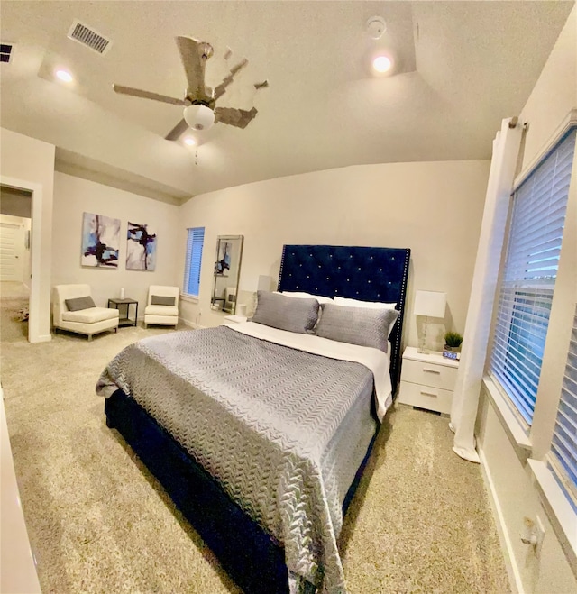 bedroom featuring light colored carpet and ceiling fan