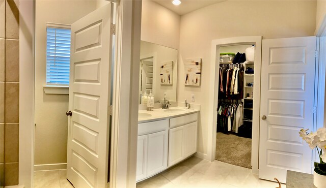 bathroom with tile patterned floors and vanity