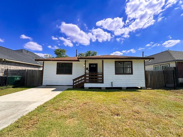 ranch-style home with a front lawn