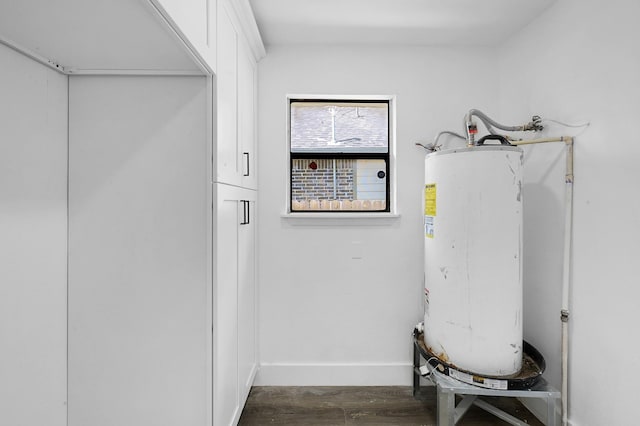 utility room featuring water heater