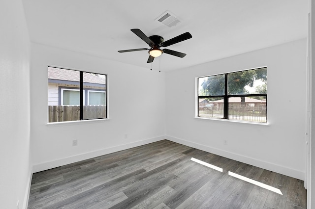 spare room with ceiling fan and wood-type flooring