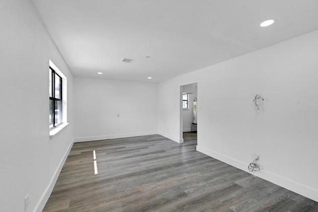 empty room featuring dark wood-type flooring