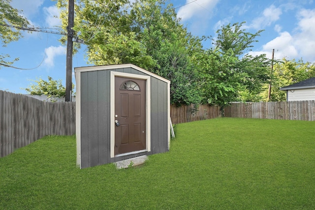 view of outbuilding featuring a yard