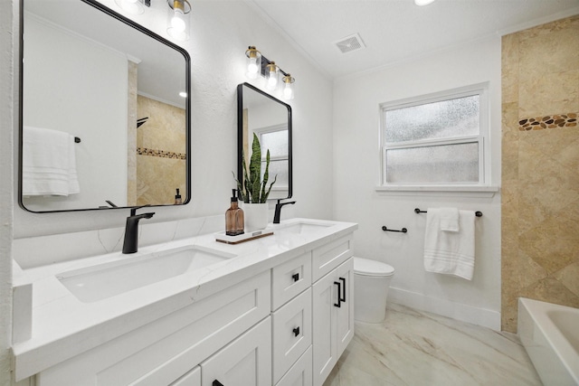 full bathroom featuring vanity, toilet, ornamental molding, and tiled shower / bath combo