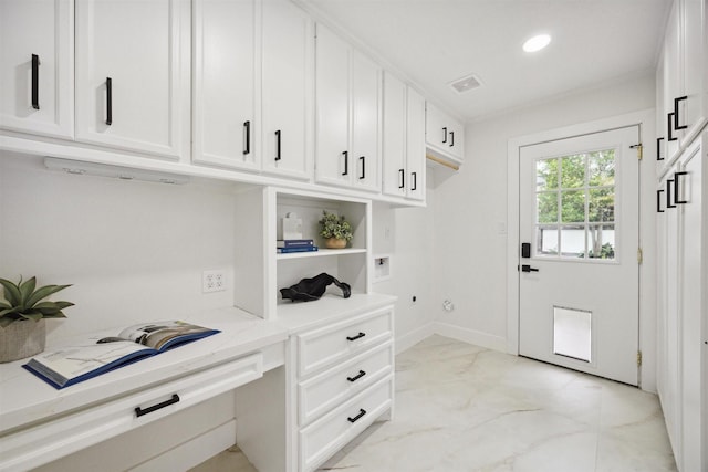 mudroom with built in desk