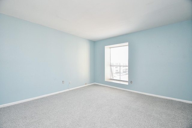 empty room with carpet flooring