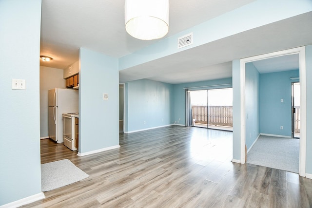 unfurnished living room with light hardwood / wood-style floors