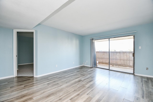 spare room featuring light hardwood / wood-style floors