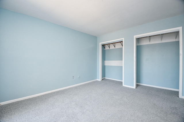 unfurnished bedroom with carpet flooring and a closet