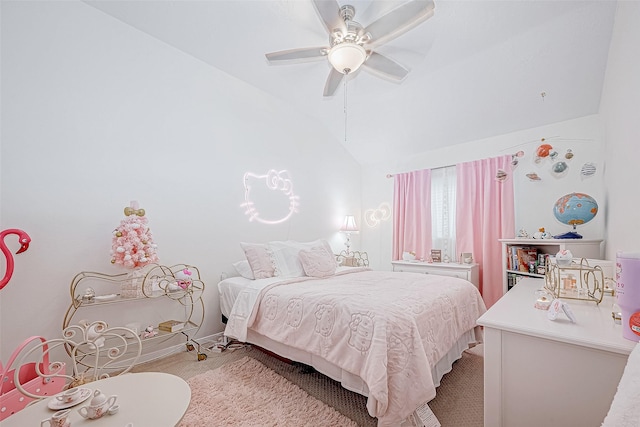 bedroom featuring ceiling fan, lofted ceiling, and light carpet