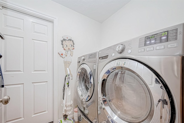 washroom featuring washer and dryer