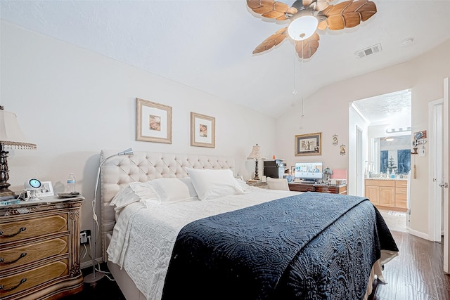 bedroom with wood-type flooring, connected bathroom, ceiling fan, and lofted ceiling