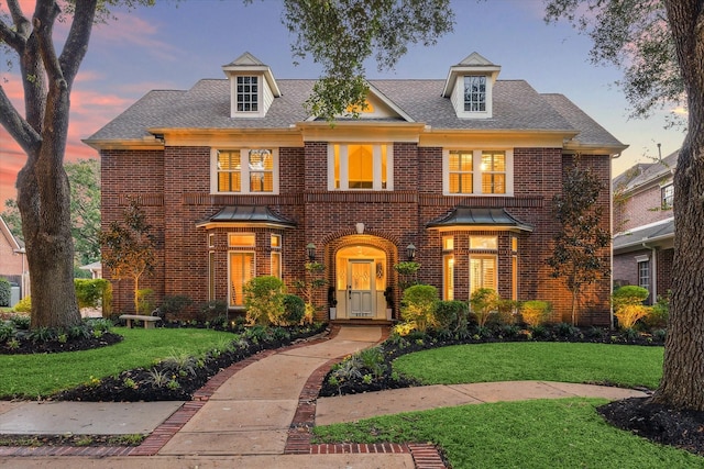 view of front of home with a yard