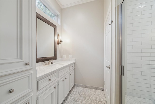 bathroom with tile patterned flooring, vanity, a shower with shower door, and crown molding