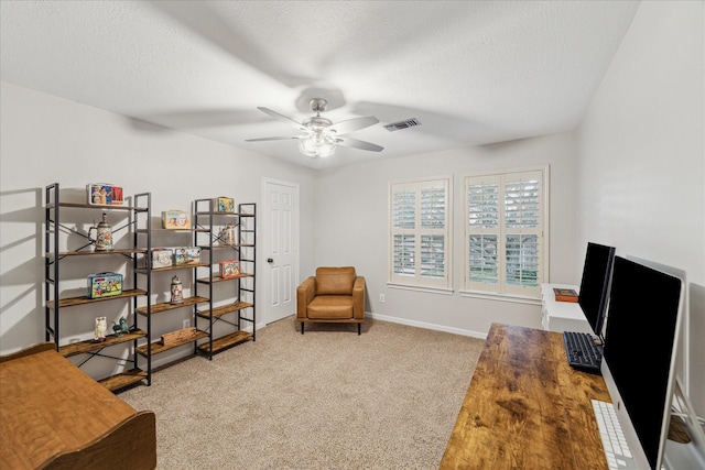 interior space featuring ceiling fan and a textured ceiling