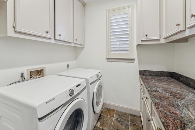 laundry area with cabinets and washing machine and clothes dryer