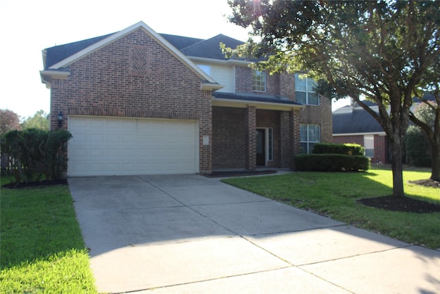 view of front property featuring a front yard and a garage