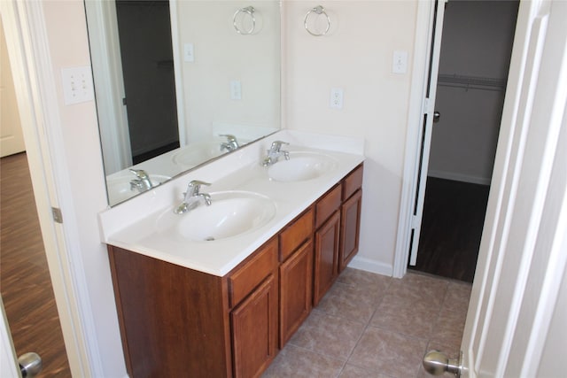 bathroom featuring tile patterned flooring and vanity