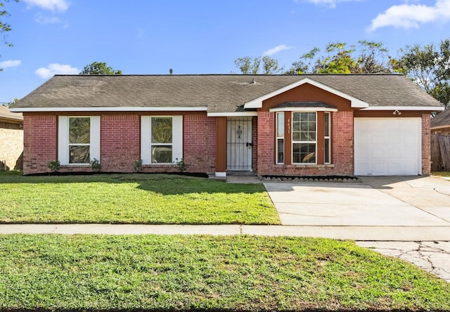 ranch-style home featuring a front yard and a garage