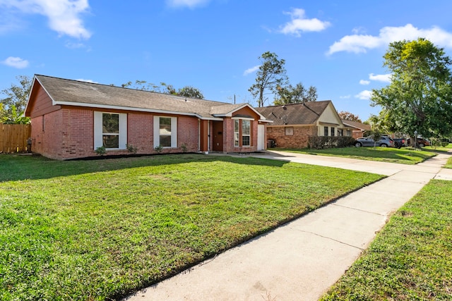 ranch-style home with a front yard