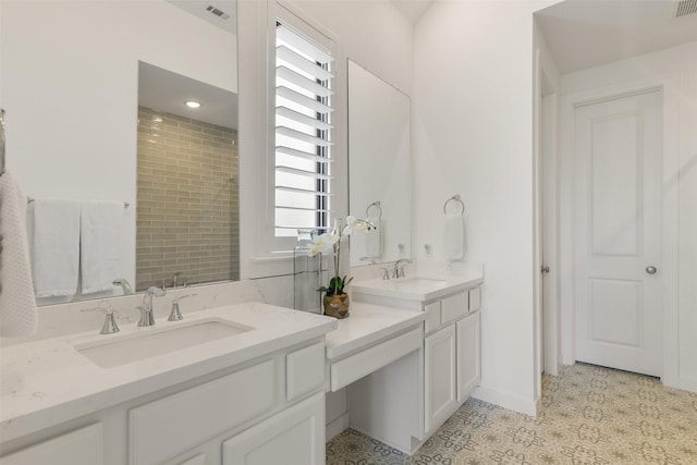 bathroom with vanity and tile patterned flooring