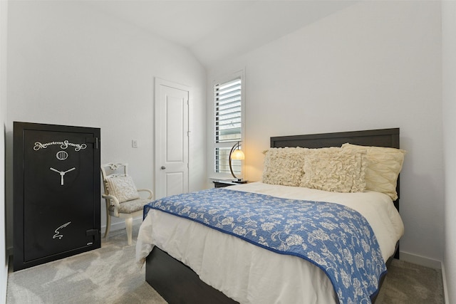 bedroom featuring carpet and lofted ceiling