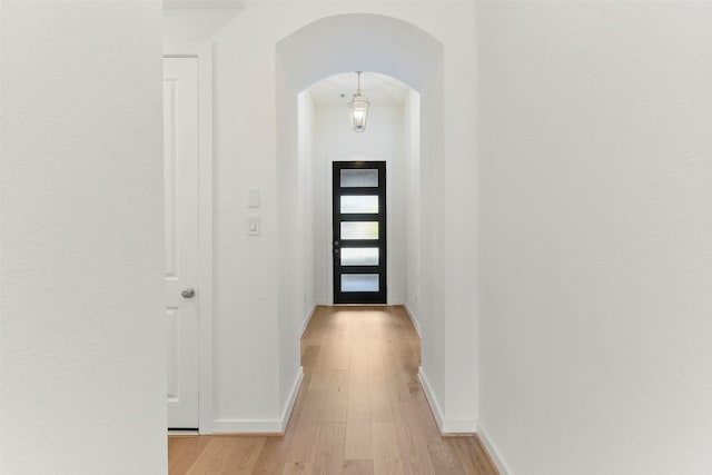 corridor with light hardwood / wood-style flooring