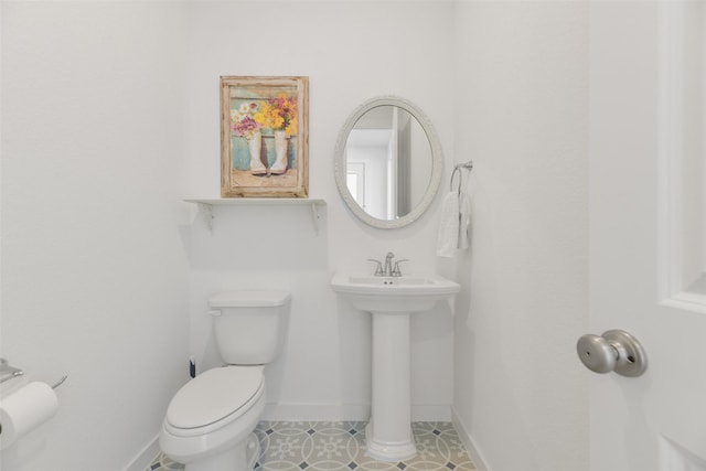 bathroom featuring tile patterned floors, sink, and toilet