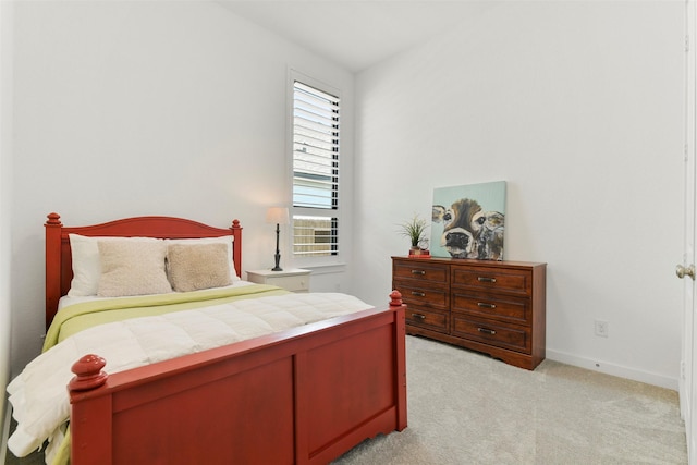 bedroom with light carpet