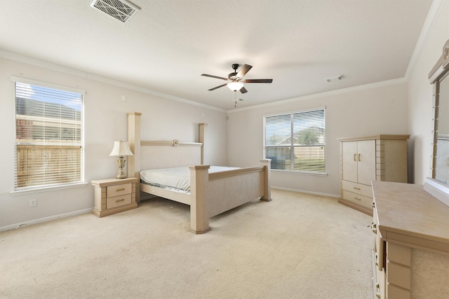 carpeted bedroom featuring multiple windows, ceiling fan, and crown molding