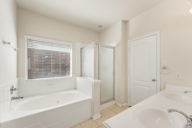 bathroom featuring tile patterned flooring, vanity, and plus walk in shower