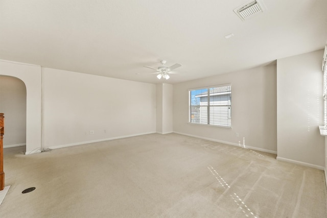 unfurnished room featuring light colored carpet and ceiling fan