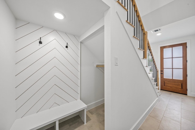 mudroom with light tile patterned floors