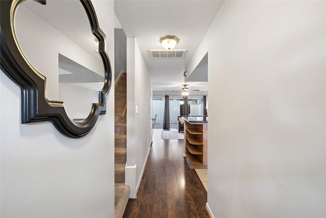 hallway featuring dark hardwood / wood-style floors