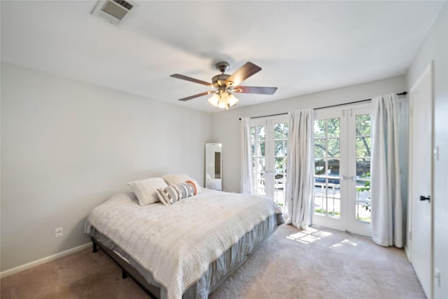 carpeted bedroom with ceiling fan, access to outside, and french doors