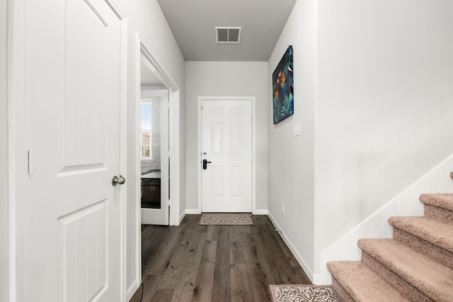 hallway with dark hardwood / wood-style floors