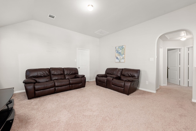 living room featuring light colored carpet and lofted ceiling