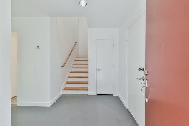 entrance foyer featuring concrete flooring