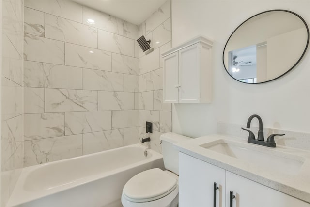 full bathroom with vanity, toilet, and tiled shower / bath