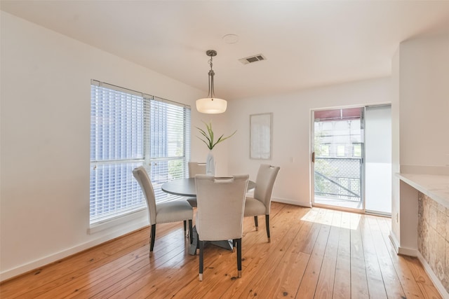 dining area with light hardwood / wood-style flooring