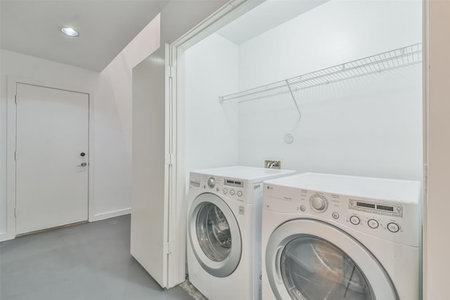 laundry area with washing machine and dryer