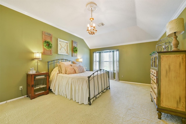 carpeted bedroom with a chandelier, lofted ceiling, and ornamental molding