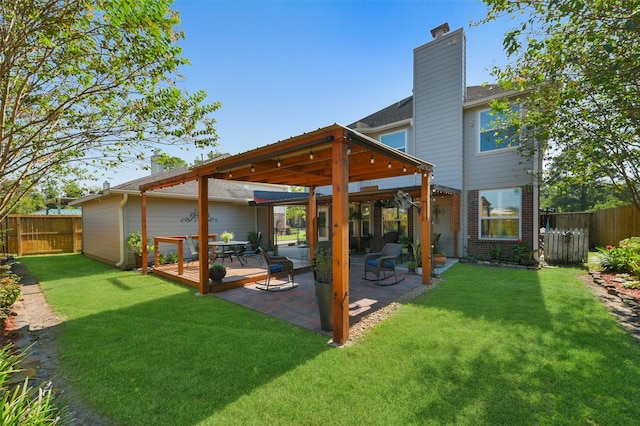 rear view of house with a lawn