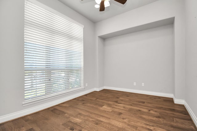 spare room featuring dark hardwood / wood-style floors